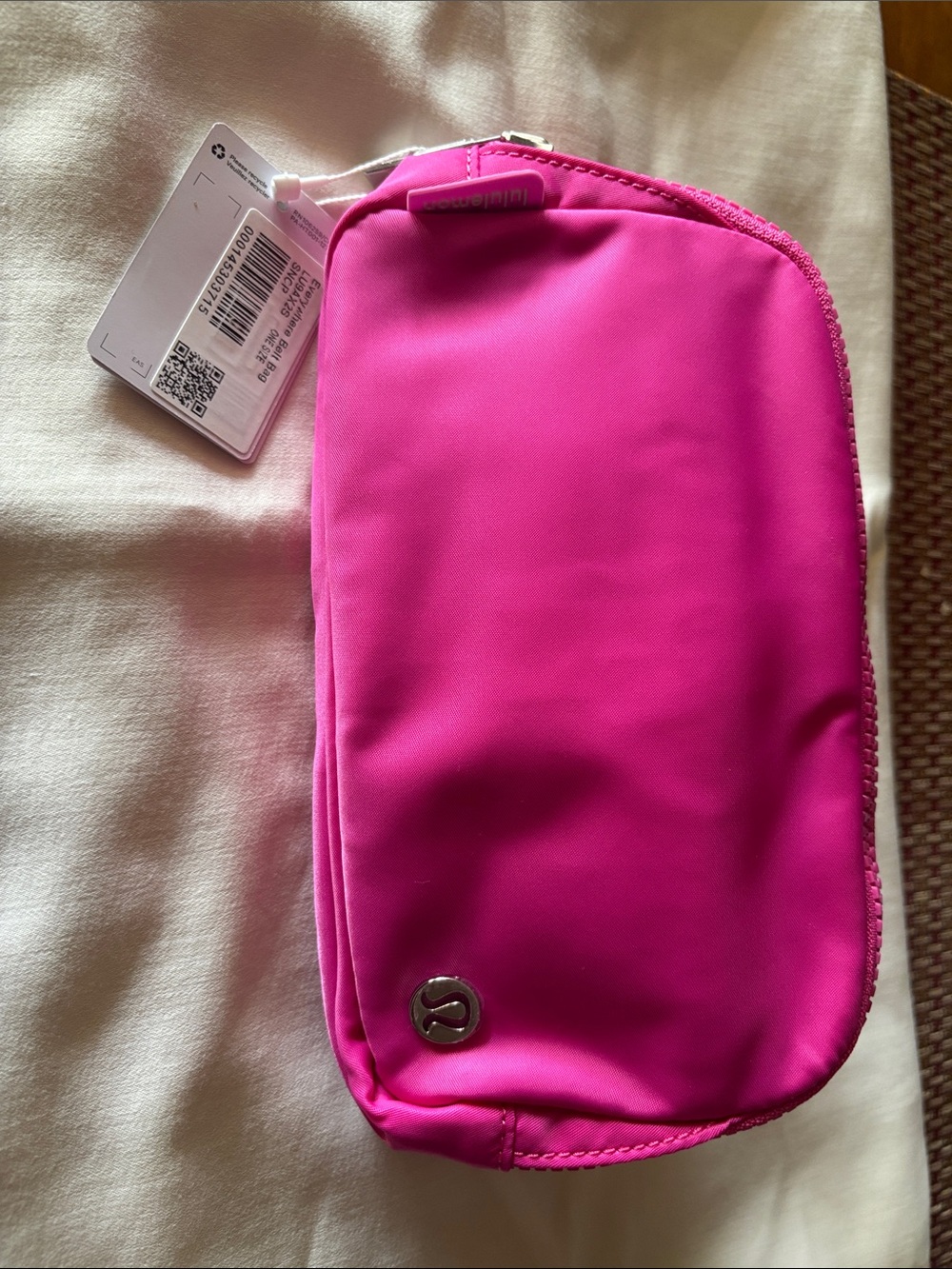 lululemon athletica Crossbody Pouch in Sonic Pink with metal hardware.